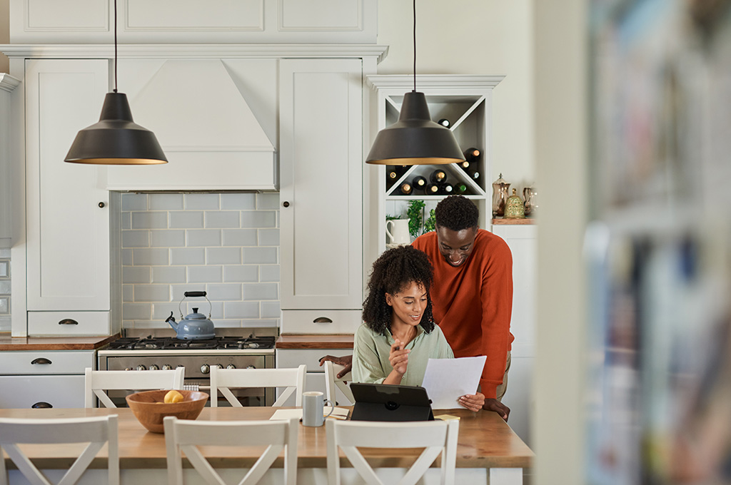 A husband and wife looking over their finances after separating from the military