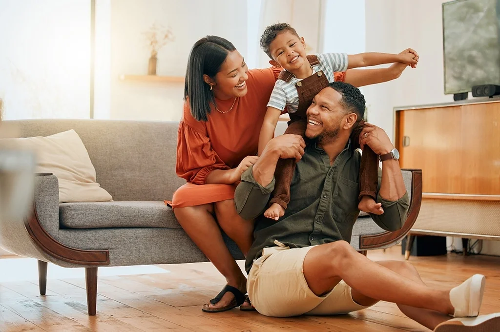 A family at home in their living room
