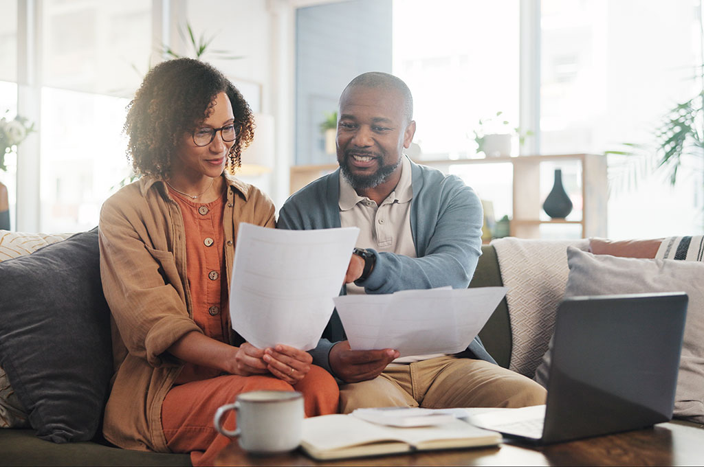 A veteran and her husband look over jobs to help with her transition from a military officer to a civilian