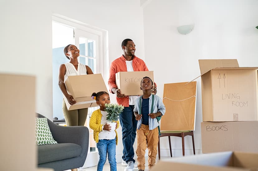 A family with two children moving into a house.