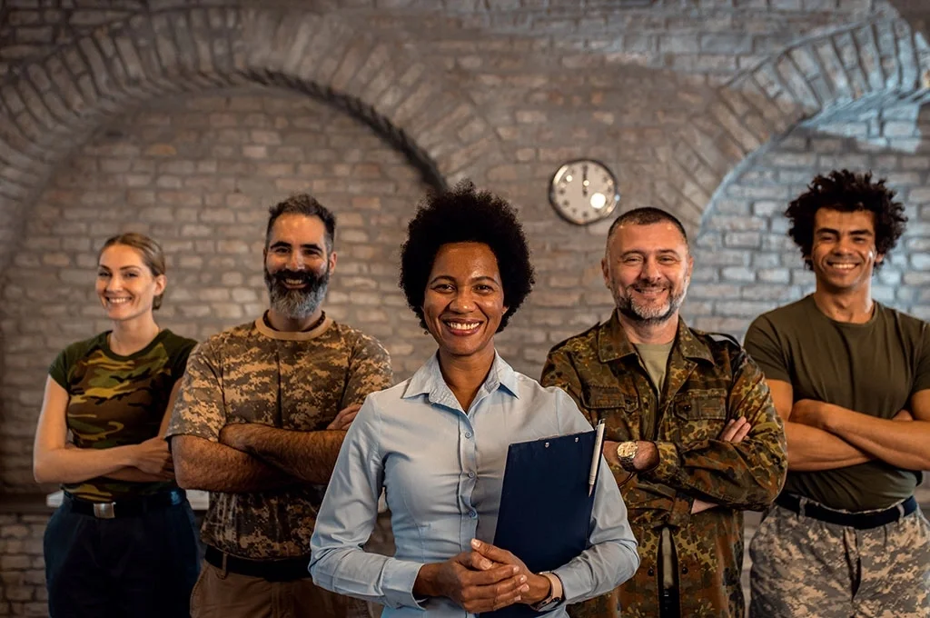 Veterans standing with a VA agent