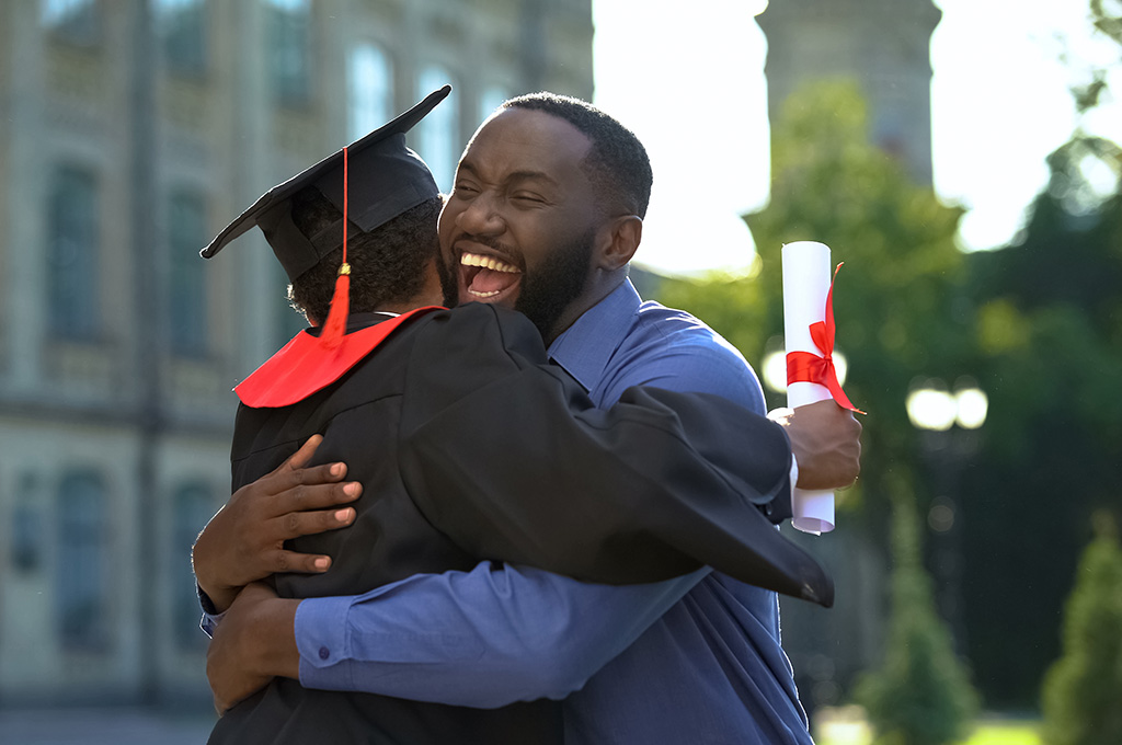A veteran at his son’s graduation, ready to use a 519 plan for California residents for college expenses
