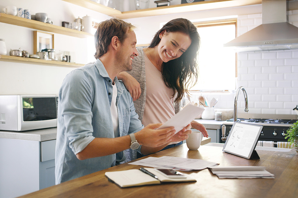 A veteran couple examines their DTI before applying for a VA home loan